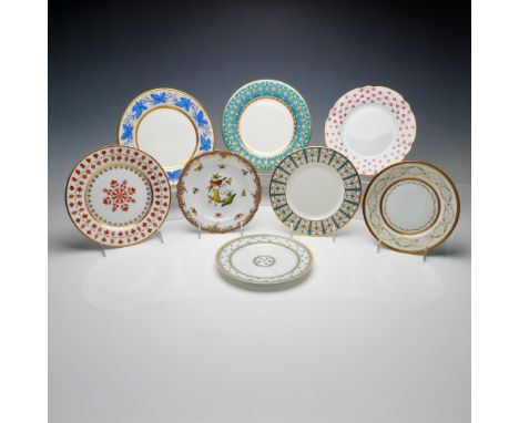 A magnificent collection of 8 fine porcelain plates featuring exquisite designs from some of Europes most prestigious porcela