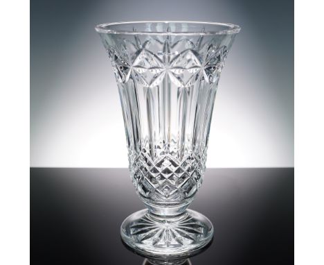 This elegant footed vase from the renowned Irish crystal maker Waterford belongs to the timeless Balmoral pattern. It feature