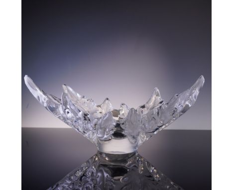 A strikingly sculptural centerpiece from Lalique, this large crystal bowl features an organic crown of curved leaf forms in h