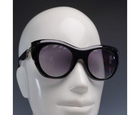 Chic and bold, these Tod's designer sunglasses feature a glossy black acetate cat eye frame with a sophisticated silhouette, 