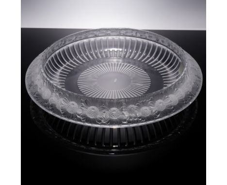 A dazzling round Lalique crystal bowl featuring the Marguerites (Daisies) pattern along the wide rim in raised frosted relief
