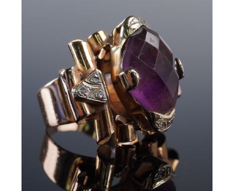 This striking Retro-era ring is crafted in solid 18K gold and features a richly colored faceted amethyst in a secure prong se