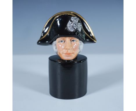 A fine china chess piece depicting Vice-Admiral Lord Nelson, produced by Michael Sutty. The hand painted figure features a de
