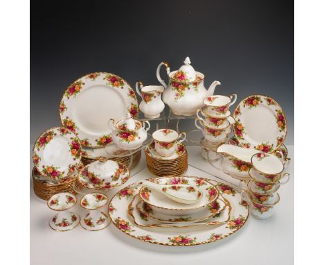 This refined 71-piece fine bone china dinnerware set by Royal Albert features the beloved Old Country Roses pattern, original