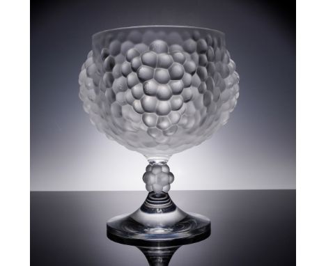 Featuring a wide open bowl supported by a sculptural pedestal base adorned with a detailed cluster of grapes design. This ver