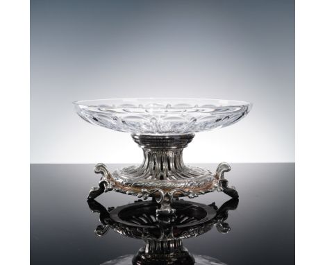 The design comprises a two-piece construction with a round clear cut crystal bowl and an ornate silver-plated pedestal base. 