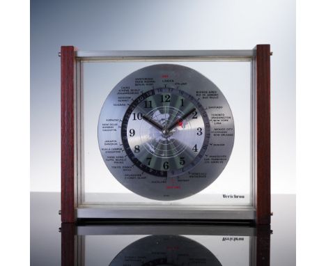 This Verichron world time desk clock features a brushed metal dial with a global map at its center and a rotating 24-hour rin