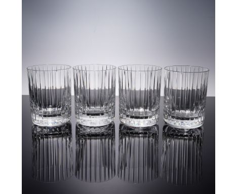 Set of four Baccarat crystal tumblers in the iconic Harmonie pattern, featuring a bold vertical cut design that emphasizes th
