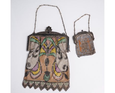 A pair of appealing coin purses, each with vibrant hand painted enamel patterns. The smaller coin purse is decorated with sim