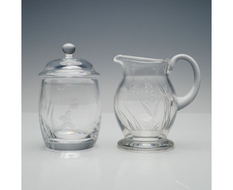 A graceful 2-piece crystal sugar and creamer set by renowned British designer William Yeoward, known for blending classical e