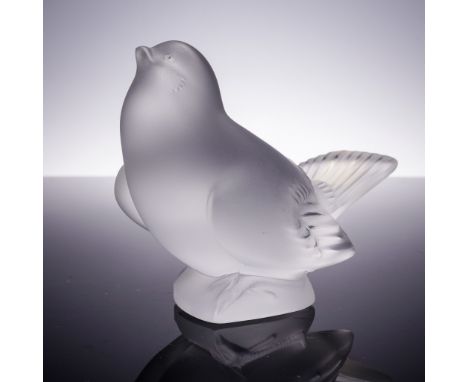 This endearing frosted crystal figurine by Lalique features a sparrow perched with its head tilted upward in a lifelike, inqu