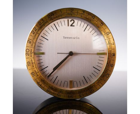 A mid-century Swiss made desk clock by Tiffany &amp; Co., featuring a brushed silver tone dial marked with black baton indice