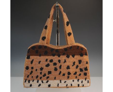 Stylish evening bag crafted with intricate beaded detailing in a bold animal print pattern of golden brown, black, and white 