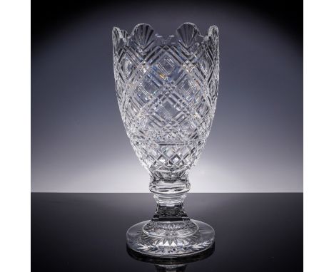 This elegant Waterford crystal footed vase features a deeply cut crisscross and vertical pattern in brilliant clear crystal, 