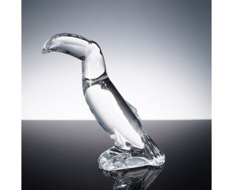 This elegant Baccarat clear crystal figurine captures the bold and distinctive silhouette of a toucan with sleek, stylized fo