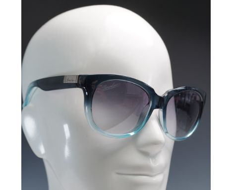 These Italian-made sunglasses from Borsalino feature a striking cat eye silhouette with a smooth gradient blue ombre acetate 