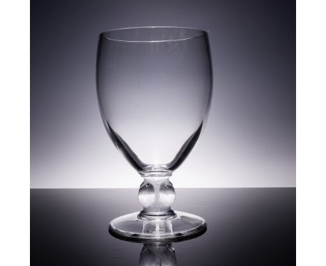 This elegant crystal vase from Lalique's Clairvaux pattern showcases the brand's refined minimalist approach with clean curve
