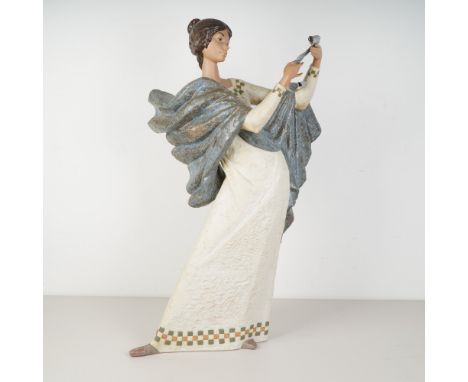 Commanding in presence and classical in form, this large-scale Lladro porcelain figurine titled Lectora (The Reader) by Alfre