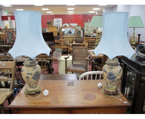 A Pair of Ceramic Table Lamps, with blue floral decoration on salmon pink ground, together with blue shades, 81cm high overal