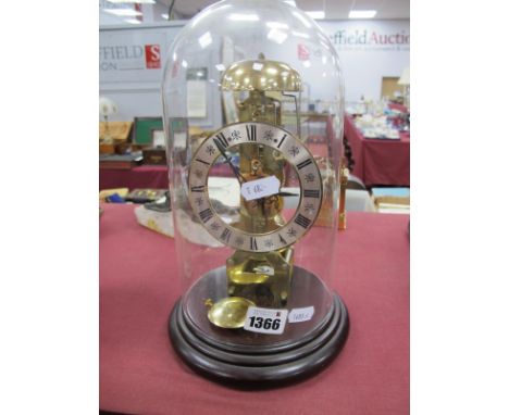 A XIX Century Brass Skeleton Clock, with a silver chapter ring, Roman numerals on circular stepped base, glass dome, 27cm hig