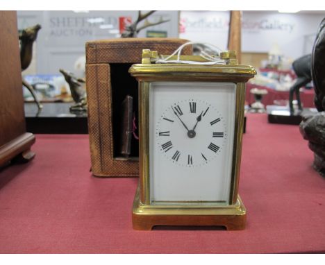 An Early XX Century French Brass Cased Carriage Clock, the white enamel dial with Roman numerals, back door missing 11cm high