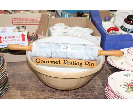 A Mason Cash mixing bowl and marble rolling pin on stand