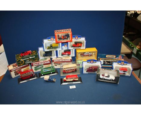 A quantity of model vintage cars and buses including Oxford Die-cast replicas and Great British Buses, plus an old tin model 