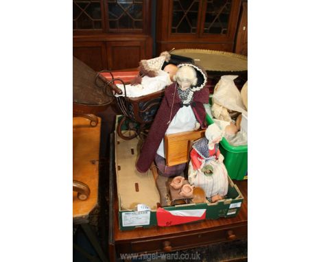 A reproduction vintage dolls pram with baby doll, two old ladies on wooden plinth including one seated with terracotta bowls.