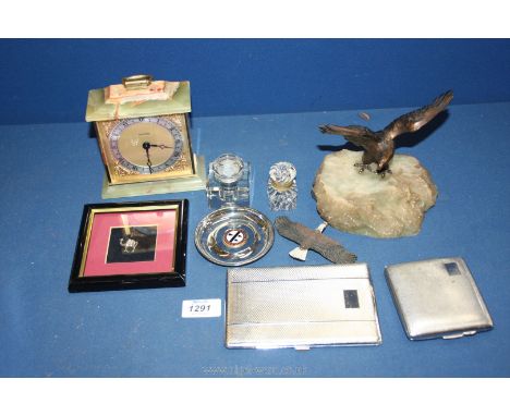 A quantity of miscellanea to include; small silver camel (framed), eagle sculpture, H. Samuels clock, cigarette case, glass i