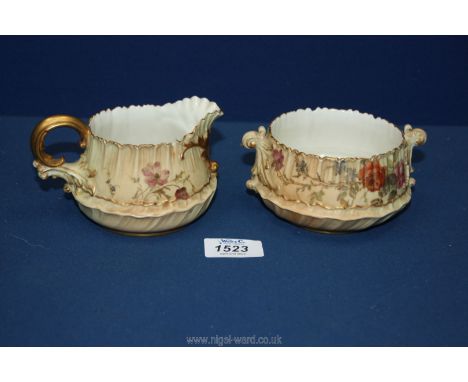 A Royal Worcester blush milk jug and sucrier reg. no. 198833 and 1613 to the bases, (small chip to rims).