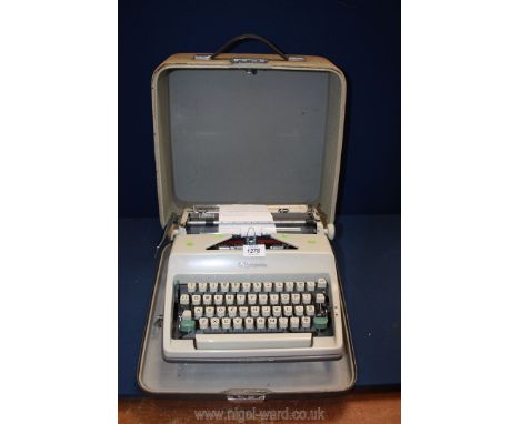 A cased Olympia typewriter.