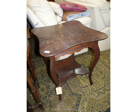 A 1930/40's Oak shaped top occasional Table, the legs mounted by a lower shelf, 23 3/4'' x 23 3/4'' x 28 1/2'' high.