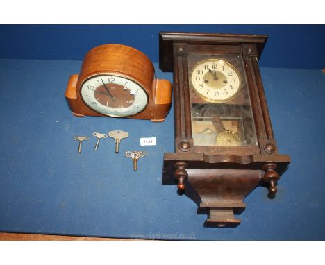 A Smiths wooden mantle Clock with key, 10 1/2'' wide x 7 1/2'' tall and a wall Clock, 18'' high x 10'' wide.
