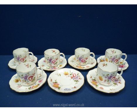 Six Royal Crown Derby coffee cups and seven saucers in ''Derby Posies'' pattern.