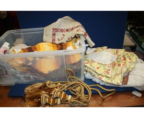 A quantity of textiles including modern chenille runner printed and embroidered cushion covers, three heavy gold fabric curta