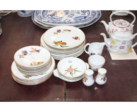 A quantity of Royal Worcester Evesham pattern dinner ware including dinner, side and sweet plates, bowls, milk jug, salt and 