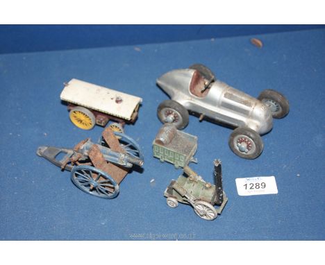 A quantity of vintage metal toy vehicles including Schuco Germany racing car, Lesney Amusement steam tractor, artillery gun t