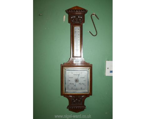 An oak cased barometer/thermometer