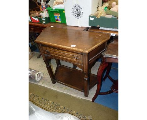 A Priory Oak style Credence style Side Table having a frieze drawer, the turned detail legs united by a pot board style low s