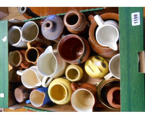 A box containing a quantity of ceramic items including jugs, stone jars, etc.