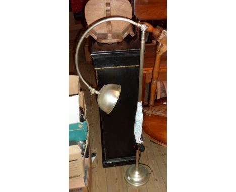 A Laura Ashley reproduction standard reading lamp with metal shade and poseable top section, set on circular base