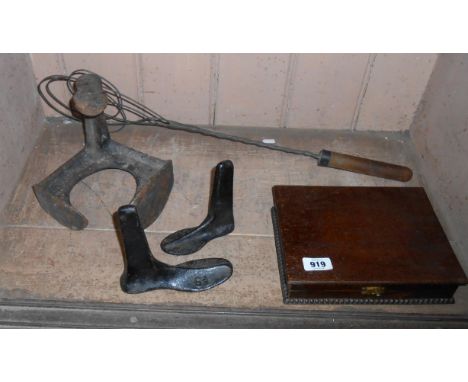 A small quantity of collectable items comprising cast iron shoe lasts, wirework carpet beater and a small oak cutlery box