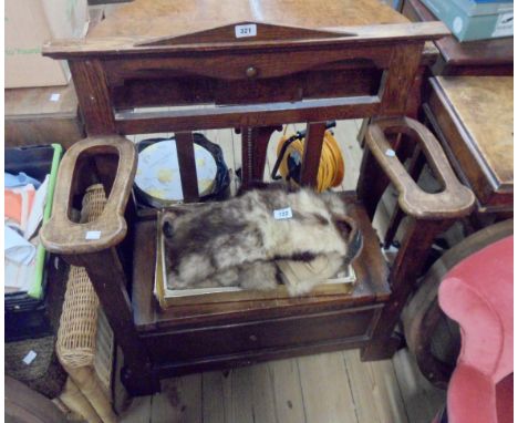 An 81cm old oak hall locker seat with flanking stick stand form armrests and panelled front