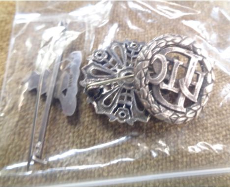 A silver and enamel Royal Artillery sweetheart brooch - sold with a Bedford Physical Training College badge and a Chartes Cat