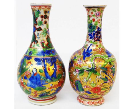 An antique Chinese porcelain bottle vase with later 'clobbered' enamel and gilt decoration - sold with another similar