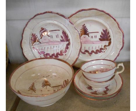 A small amount of Victorian purple lustre china comprising two cups and saucers, two bread and butter plates and a slops bowl
