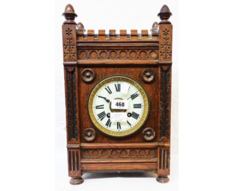 A late 19th Century Aesthetic style oak mantle clock with German eight day gong striking movement