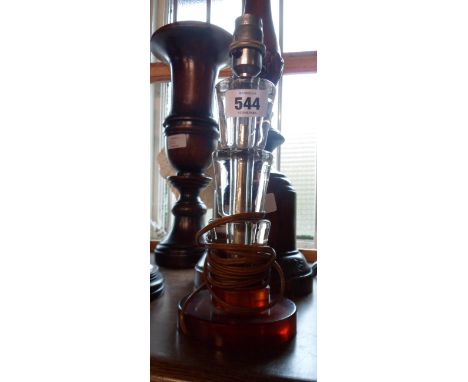 An Art Deco table lamp with stepped glass column and a phenolic base