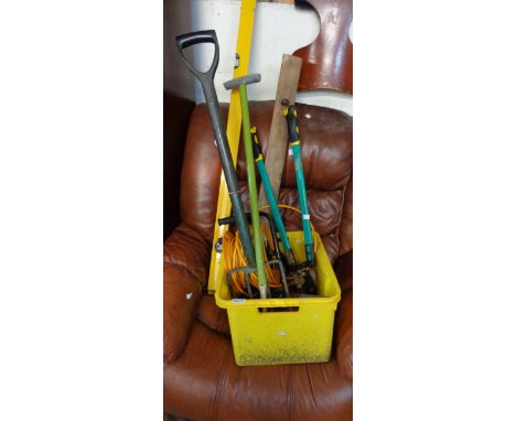 A quantity of tools and accessories including large spirit level, garden fork, shears, a JCB branded extension cable, etc.