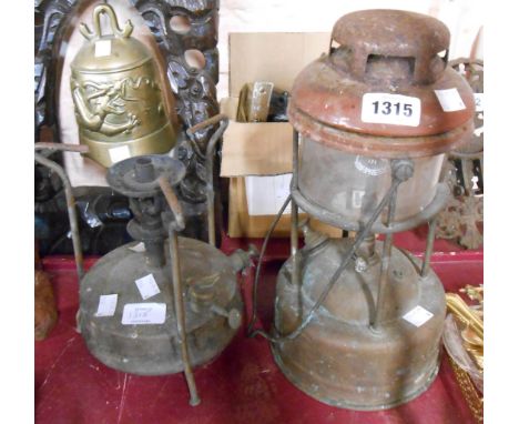 An old brass and enamel Tilley lamp - sold with an old brass primus stove